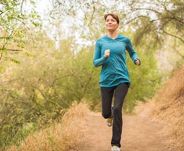 Woman running on Arizona trail